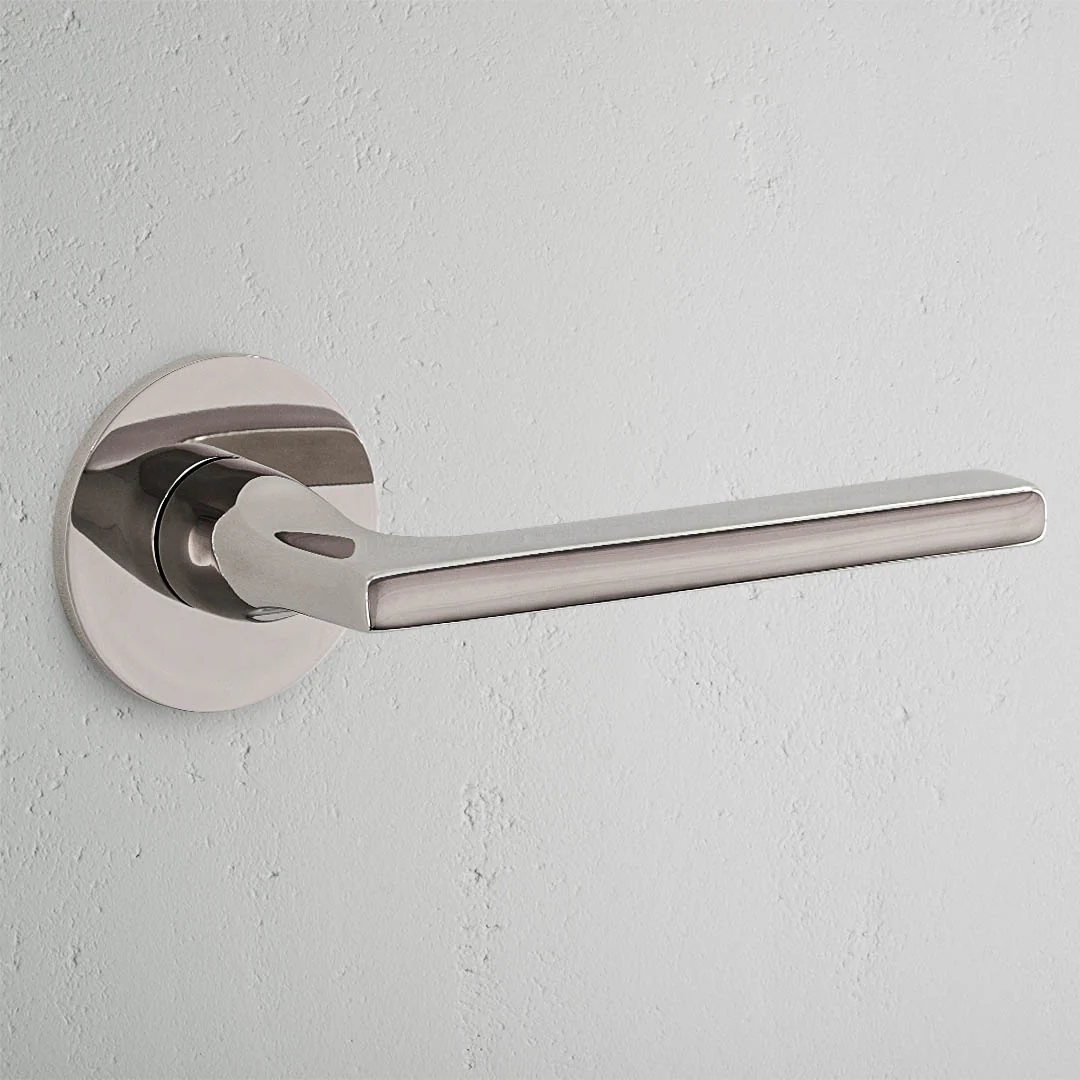 Clayton Sprung Door Handle With Flush Rose - Polished Nickel