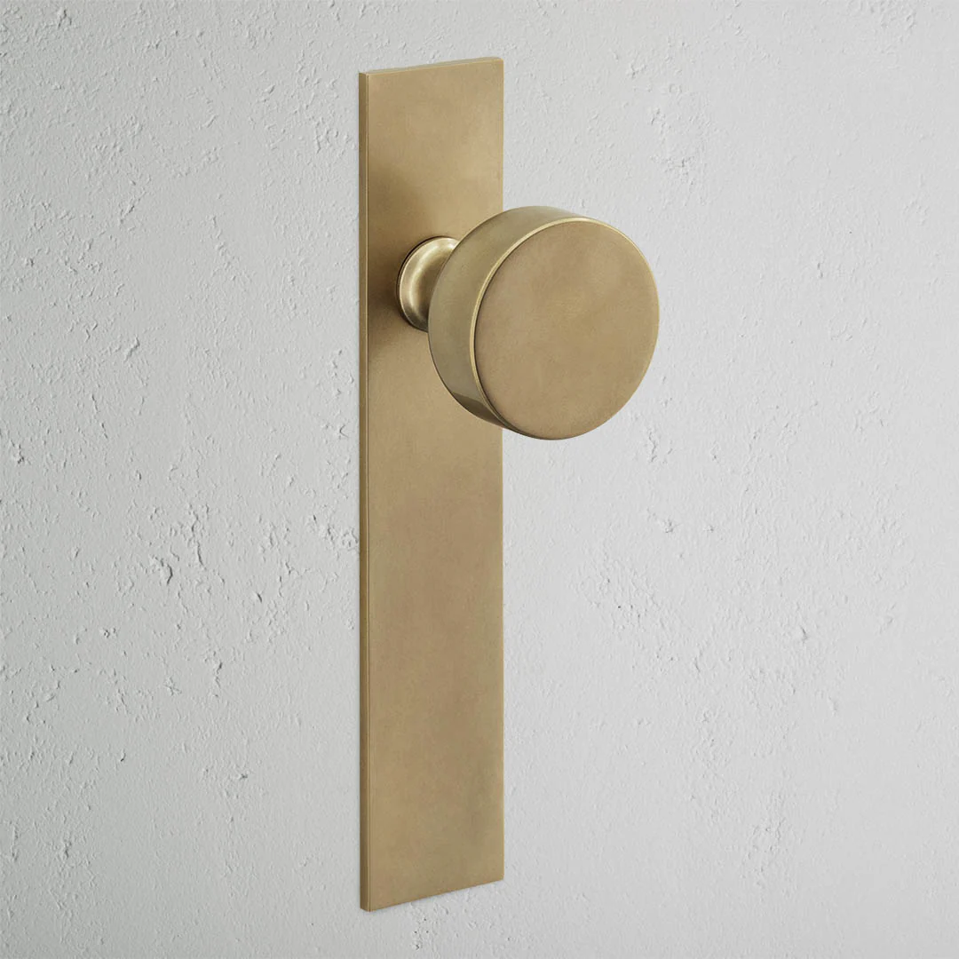 Onslow Long Plate Fixed Door Knob - Antique Brass